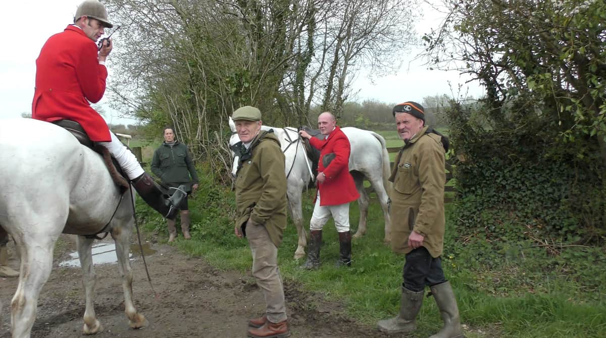 Weston and Banwell huntsman (flat cap) attending a stag hunt. Via Mendip Hunt Sabs.