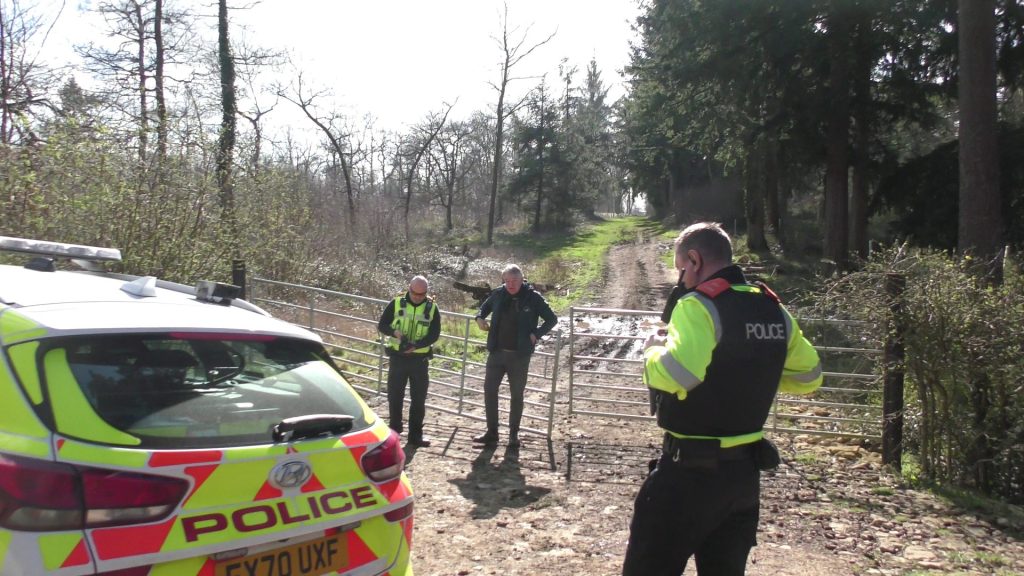 Stalker ‘boss’ Jonny Walker activates his police hotline - who then rush to him for a quiet pre-briefing (Image taken on 14/03/2026, courtesy of Mendip Hunt Sabs)